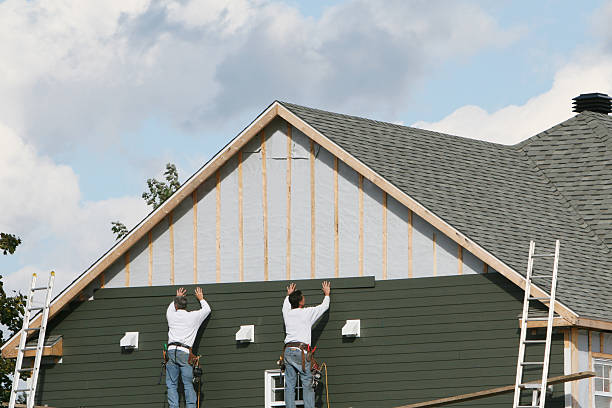 Professional Storm Damage Siding Repair technician working in Mundelein, IL